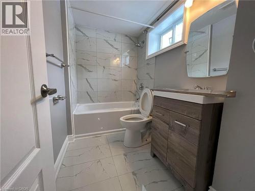 Full bathroom with vanity, shower / bath combination, and light marble finish flooring - 29 Birchcliffe Crescent Unit# 2, Hamilton, ON - Indoor Photo Showing Bathroom