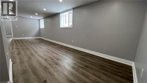 Basement with dark wood-style floors and recessed lighting - 29 Birchcliffe Crescent Unit# 2, Hamilton, ON - Indoor Photo Showing Other Room