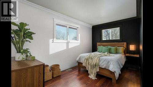 STAGED BEDROOM ON MAIN - 111 Macleod Trail E, Rural Foothills County, AB - Indoor Photo Showing Bedroom