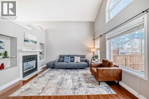Bright Living room - 188 Hidden Ranch Crescent Nw, Calgary, AB - Indoor Photo Showing Living Room With Fireplace