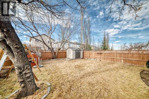 Large back yard with mature trees - 188 Hidden Ranch Crescent Nw, Calgary, AB - Outdoor