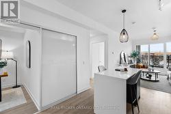 Kitchen with Centre Island Overlooking Den - 