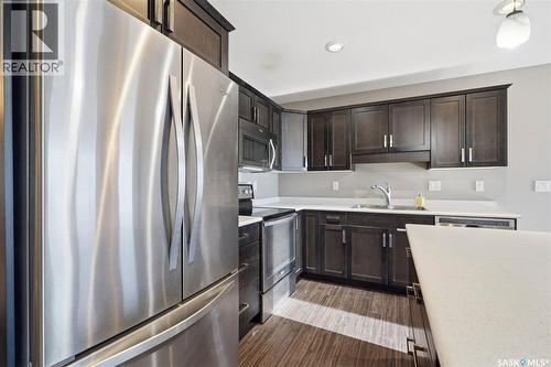 7 365 Dawson Crescent, Saskatoon, SK - Indoor Photo Showing Kitchen With Double Sink
