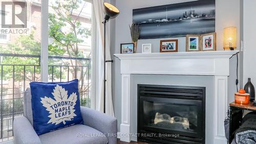 719 - 10 Laidlaw Street, Toronto, ON - Indoor Photo Showing Living Room With Fireplace