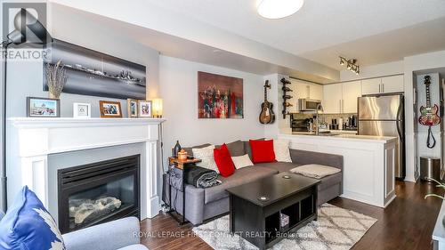 719 - 10 Laidlaw Street, Toronto, ON - Indoor Photo Showing Living Room With Fireplace