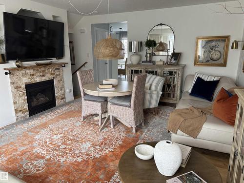 #208 178 Bridgeport Bv, Leduc, AB - Indoor Photo Showing Living Room With Fireplace