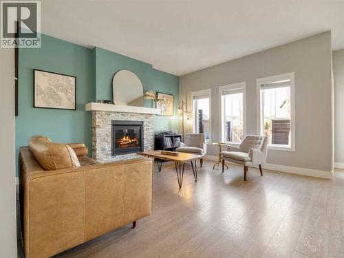 166 Crocus Terrace W, Lethbridge, AB - Indoor Photo Showing Living Room With Fireplace