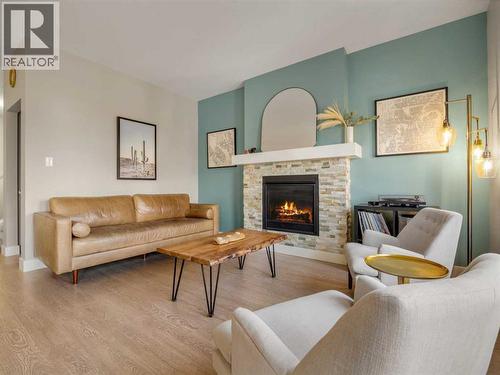166 Crocus Terrace W, Lethbridge, AB - Indoor Photo Showing Living Room With Fireplace