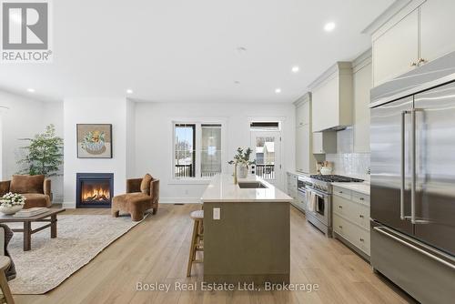 130 Fifth Street, Collingwood, ON - Indoor Photo Showing Kitchen With Fireplace With Upgraded Kitchen