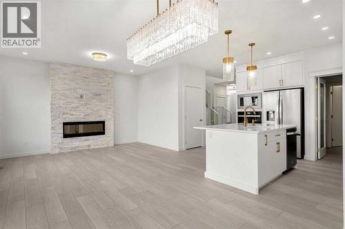 94 Cornerbrook Crescent Ne, Calgary, AB - Indoor Photo Showing Other Room With Fireplace