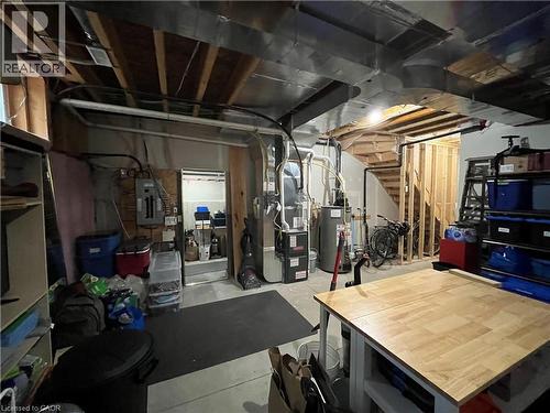 unfinished utility/storage area off of main floor entrance (old photo) - 352 Louisa Street, Kitchener, ON - Indoor Photo Showing Basement