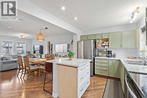 242 Elgin Place Se, Calgary, AB - Indoor Photo Showing Kitchen With Double Sink With Upgraded Kitchen
