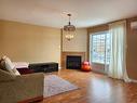 Living room - 304-2308 Rue Racine, Longueuil (Saint-Hubert), QC  - Indoor Photo Showing Living Room With Fireplace 