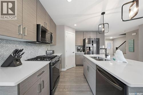 222 Newton Link, Saskatoon, SK - Indoor Photo Showing Kitchen With Double Sink With Upgraded Kitchen