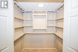 BUILT IN STORAGE CLOSET (REC ROOM) - 