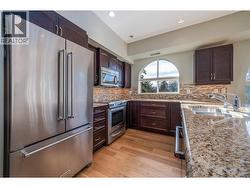 Kitchen with stainless steel appliances and lots of cupboard space! - 