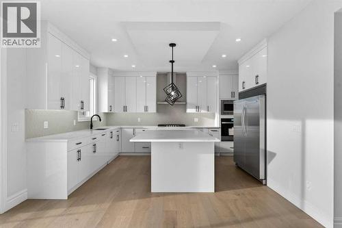 98 Waterford Crescent, Chestermere, AB - Indoor Photo Showing Kitchen With Upgraded Kitchen