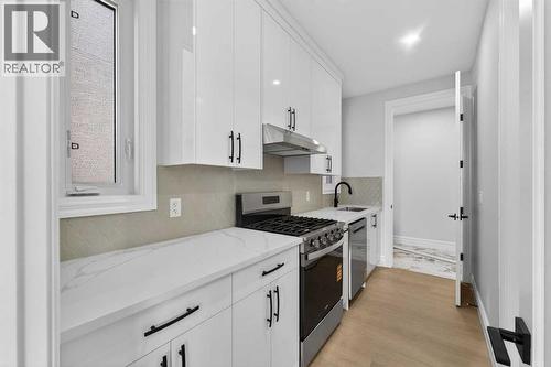 98 Waterford Crescent, Chestermere, AB - Indoor Photo Showing Kitchen With Upgraded Kitchen