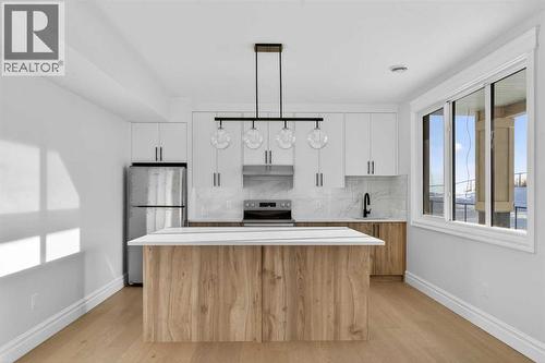 98 Waterford Crescent, Chestermere, AB - Indoor Photo Showing Kitchen With Upgraded Kitchen