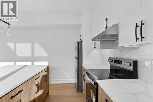 98 Waterford Crescent, Chestermere, AB - Indoor Photo Showing Kitchen With Upgraded Kitchen