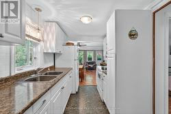 Galley kitchen overlooks side yard - 