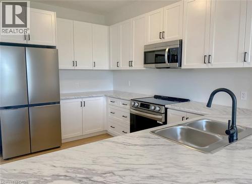 57 Lloyd Davies Way, Binbrook, ON - Indoor Photo Showing Kitchen With Double Sink