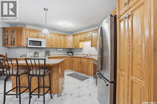 #312 2909 Arens Road E, Regina, SK - Indoor Photo Showing Kitchen With Double Sink