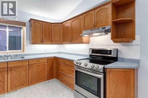 20 Willowbrook Gate Nw, Airdrie, AB - Indoor Photo Showing Kitchen With Double Sink
