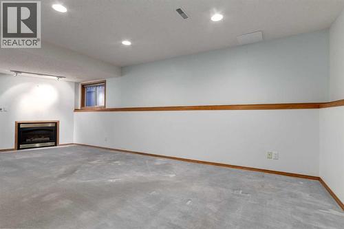 20 Willowbrook Gate Nw, Airdrie, AB - Indoor Photo Showing Other Room With Fireplace