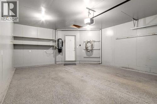 20 Willowbrook Gate Nw, Airdrie, AB - Indoor Photo Showing Garage