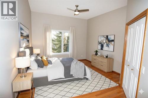 Primary Bed - Virtual Staging - 16 Eagleview Heights Nw, Cochrane, AB - Indoor Photo Showing Bedroom