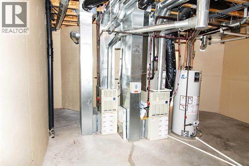 Two Furnaces - 16 Eagleview Heights Nw, Cochrane, AB - Indoor Photo Showing Basement