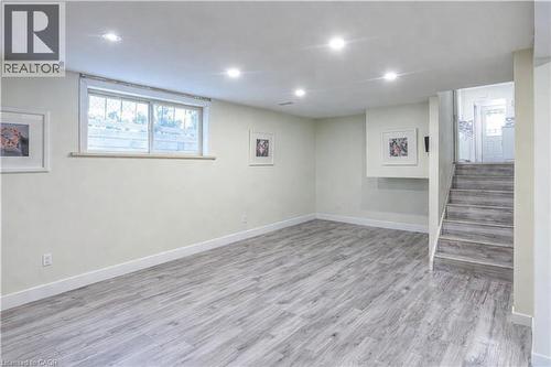 Basement with light wood-type flooring and recessed lighting - 310 Magnolia Drive, Hamilton, ON - Indoor