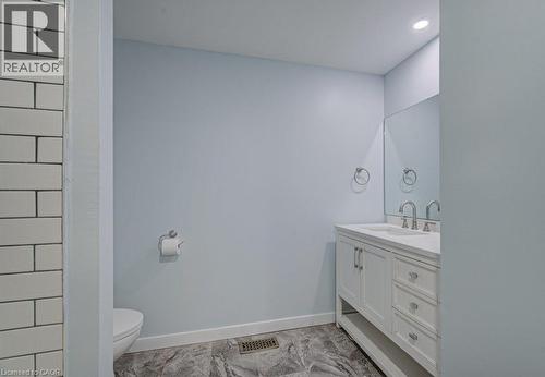 Bathroom featuring vanity and recessed lighting - 310 Magnolia Drive, Hamilton, ON 