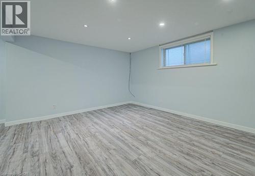 Below grade area featuring light wood-type flooring and recessed lighting - 310 Magnolia Drive, Hamilton, ON 