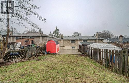Fenced backyard with a storage shed - 310 Magnolia Drive, Hamilton, ON 
