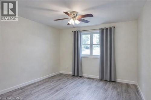 Spare room with light wood-type flooring and ceiling fan - 310 Magnolia Drive, Hamilton, ON - Indoor Photo Showing Other Room