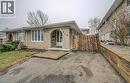 View of front of property with brick siding and a patio - 310 Magnolia Drive, Hamilton, ON 