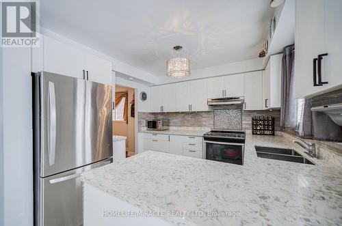 5128 Guildwood Way, Mississauga, ON - Indoor Photo Showing Kitchen With Double Sink