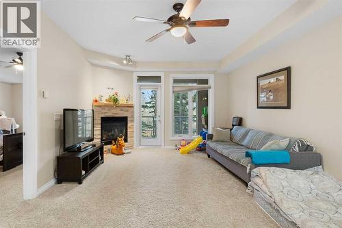 8103, 14 Hemlock Crescent Sw, Calgary, AB - Indoor Photo Showing Living Room With Fireplace