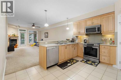 8103, 14 Hemlock Crescent Sw, Calgary, AB - Indoor Photo Showing Kitchen With Double Sink