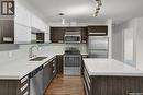 112 1545 Neville Drive, Regina, SK  - Indoor Photo Showing Kitchen With Stainless Steel Kitchen With Double Sink With Upgraded Kitchen 