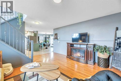 512 Highland Close, Strathmore, AB - Indoor Photo Showing Living Room With Fireplace