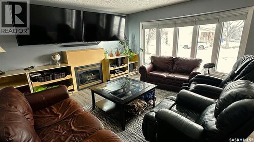 131 Dunsmore Drive, Regina, SK - Indoor Photo Showing Living Room With Fireplace