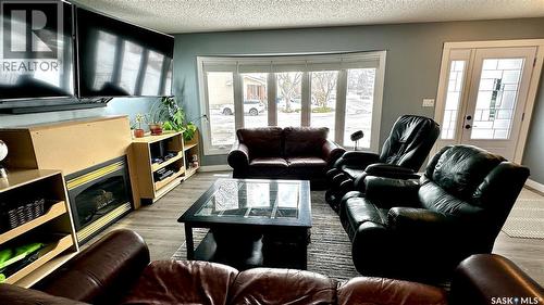 131 Dunsmore Drive, Regina, SK - Indoor Photo Showing Living Room With Fireplace