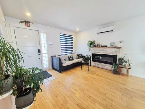 Living room - 30 Rue Circé, Delson, QC - Indoor Photo Showing Living Room With Fireplace