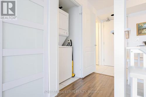Laundry door open - 405 - 4 Elsinore Path, Toronto, ON - Indoor Photo Showing Laundry Room