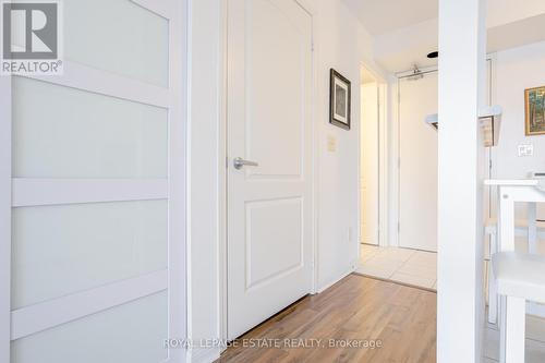 Laundry door closed - 405 - 4 Elsinore Path, Toronto, ON - Indoor Photo Showing Other Room