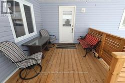 cozy and inviting covered front deck - 