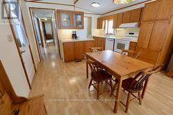 bright kitchen with ample cupboards and counters - 